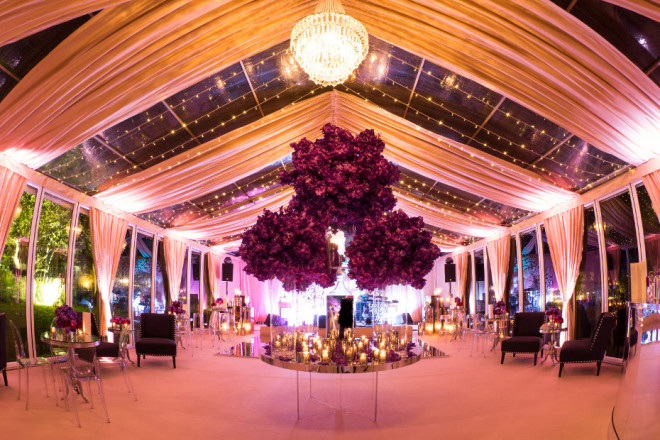 Glass marquee beautifully styled for evening wedding party