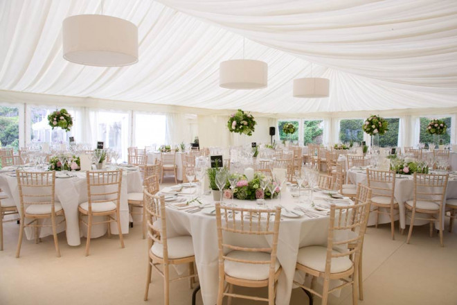 Dining tables in a marquee