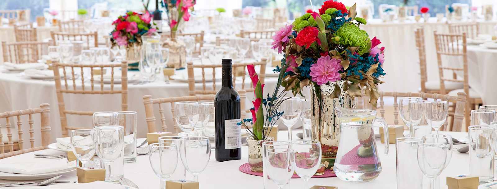 colourful flowers in marquee dining area