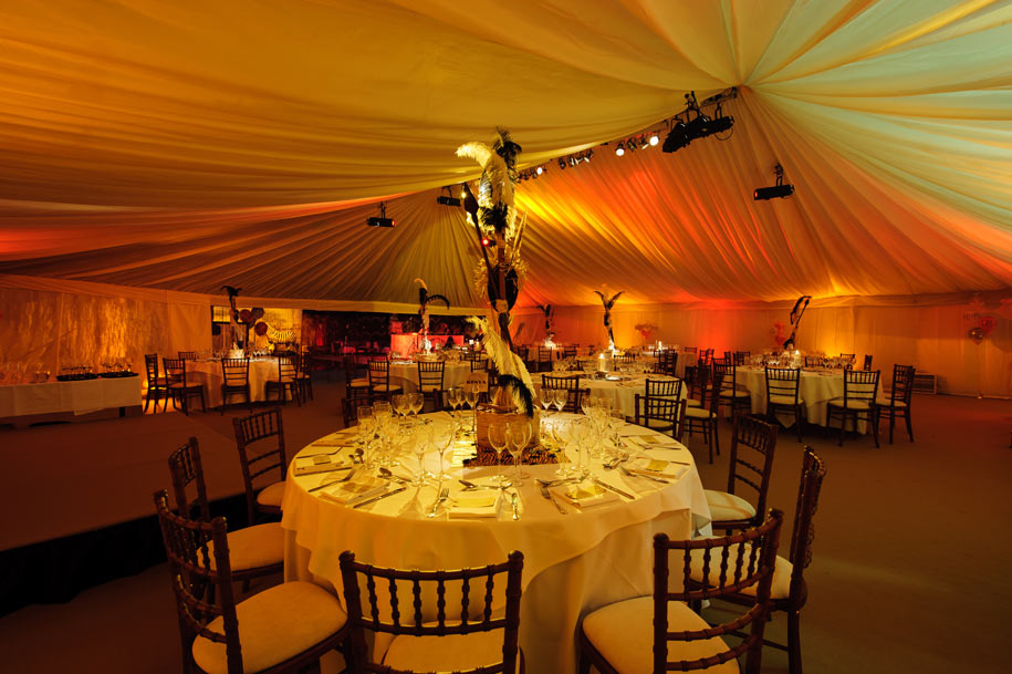 Table decorations in African savanna themed marquee
