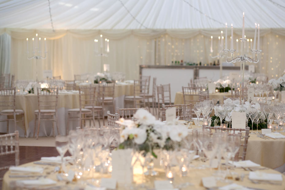 wedding reception decorations in a marquee