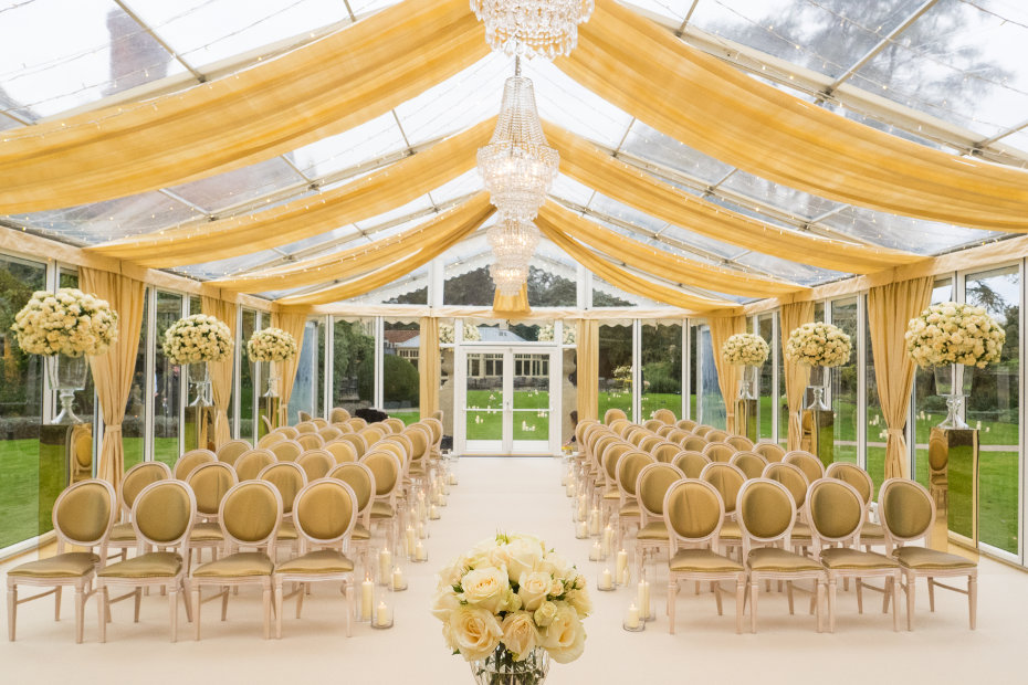 Glass marquee set up for wedding ceremony held in the grounds of Le Manoir Aux Quat' Saisons