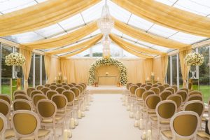Marquee with clear gable, solid window panels, clear roof with wall & roof swags and fairy light canopy